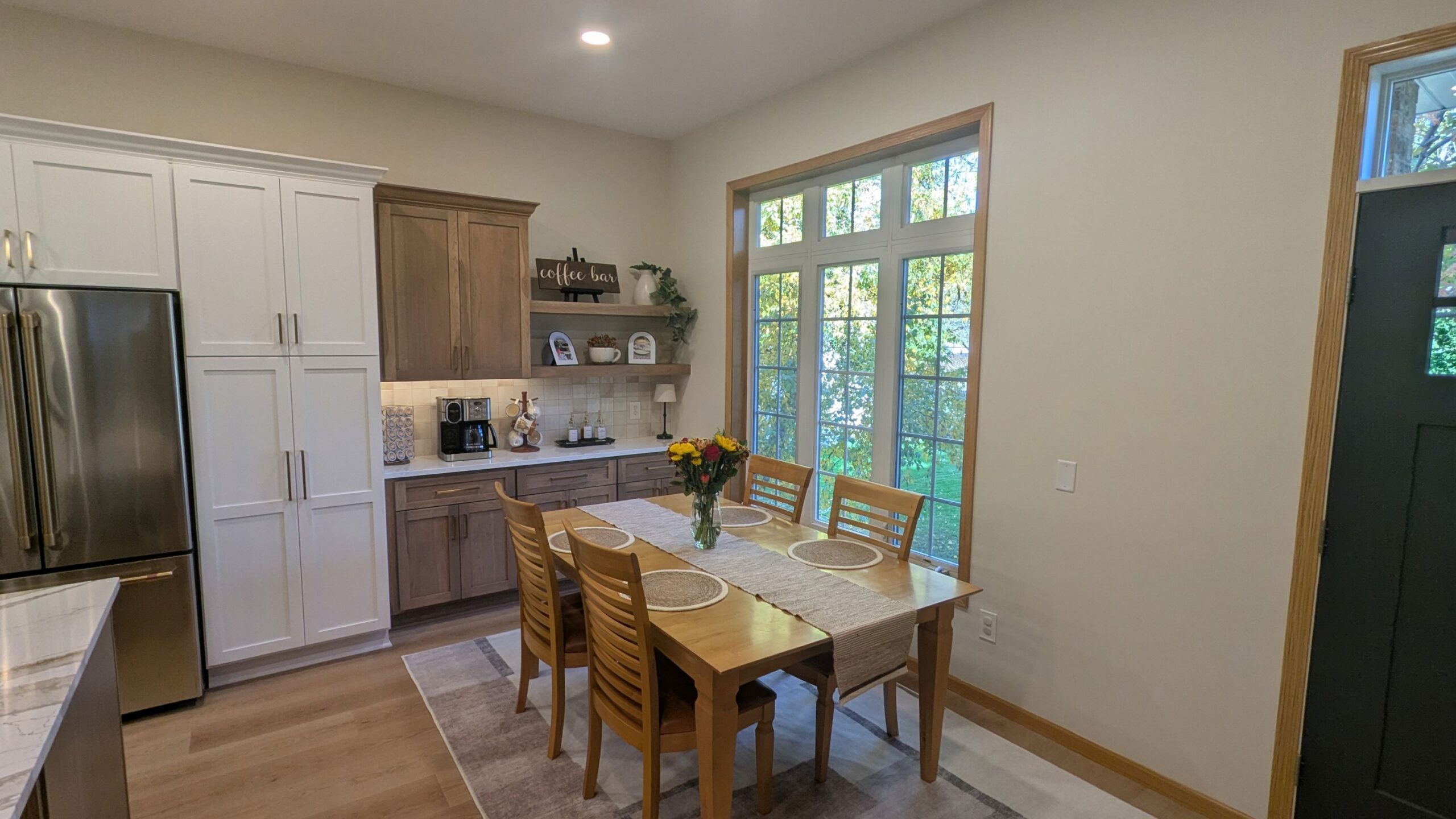 Kitchen with a coffee bar and dining area in Woodbury MN