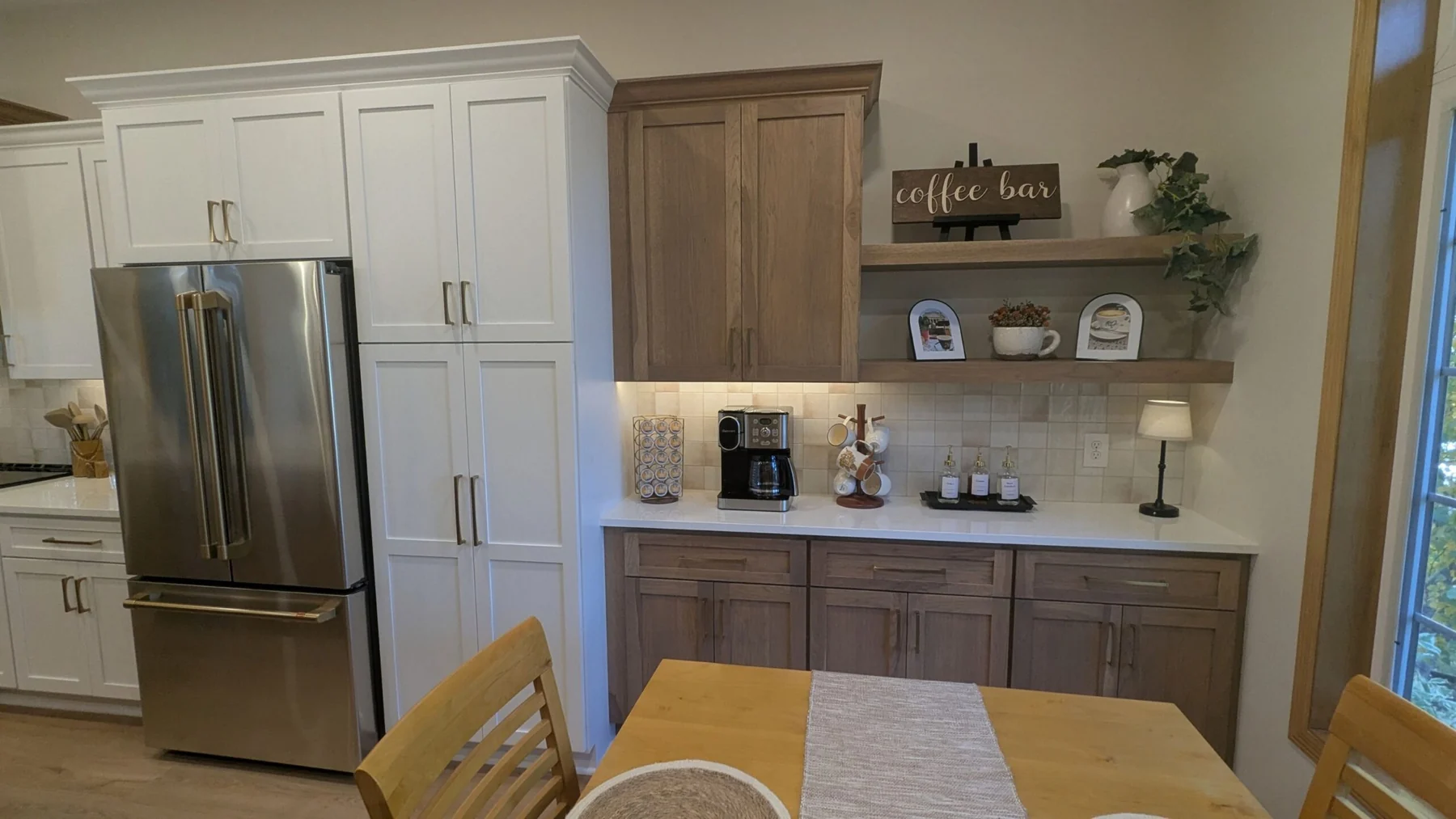 Kitchen with white and wood cabinetry and a coffee bar in Woodbury MN