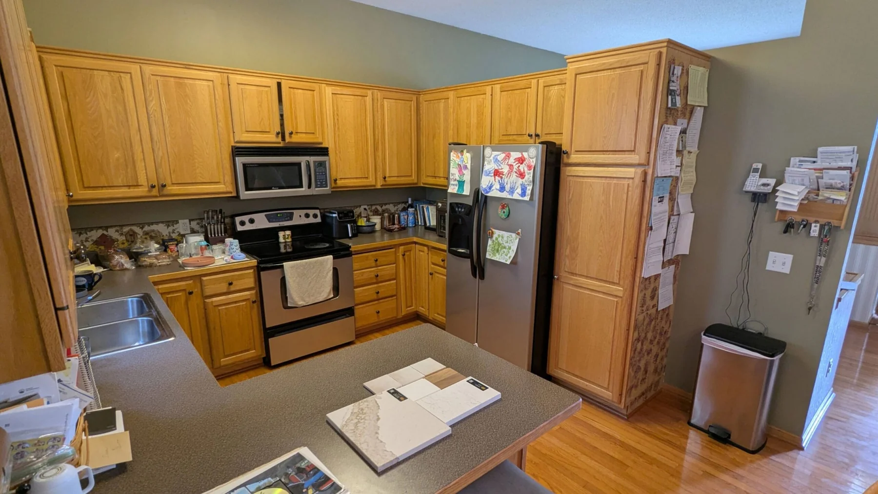 Kitchen with oak cabinets and gray countertops in Woodbury MN